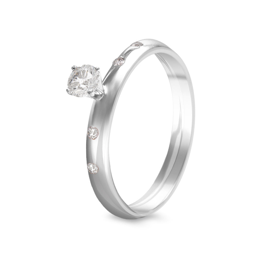 Anillo de compromiso con diamante central 0.23 ct y diamantes laterales