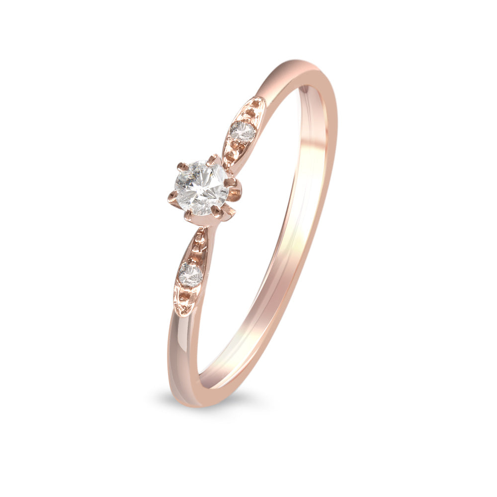 Anillo de compromiso con diamante central 0.09 ct y diamantes laterales