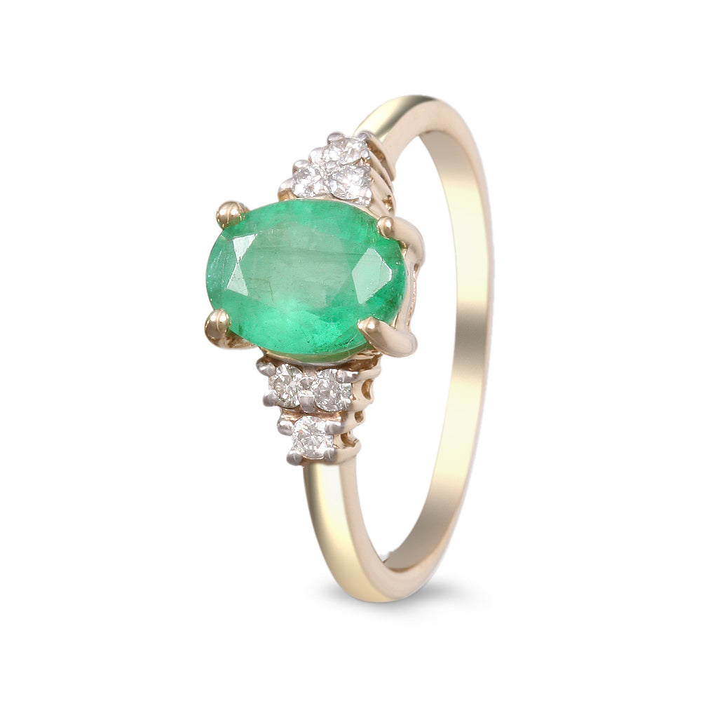 Anillo con esmeralda y diamantes laterales