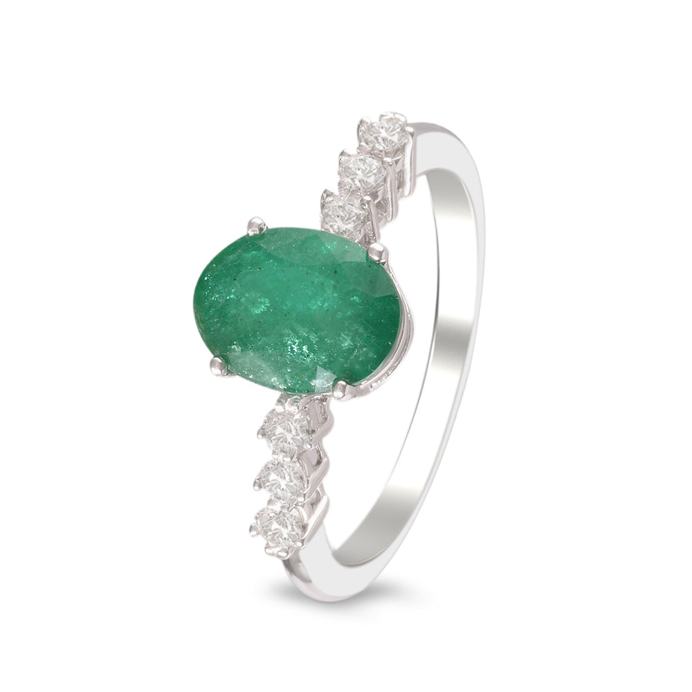 Anillo con esmeralda y diamantes laterales en oro blanco