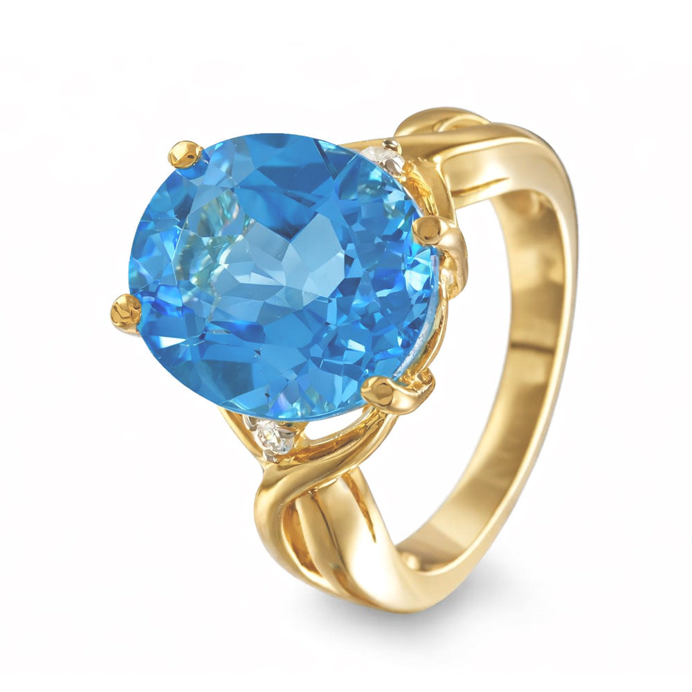 Anillo con topacio azul y diamantes laterales