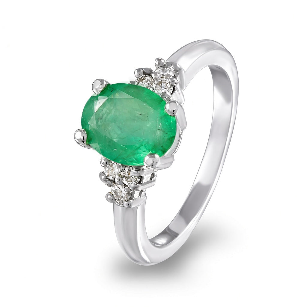 Anillo con esmeralda y diamantes laterales