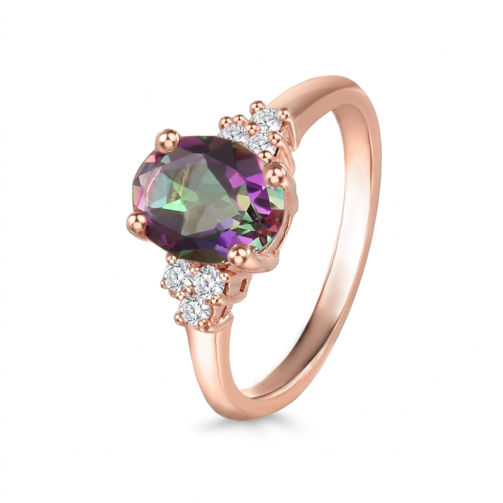 Anillo de oro rosa con topacio y diamantes