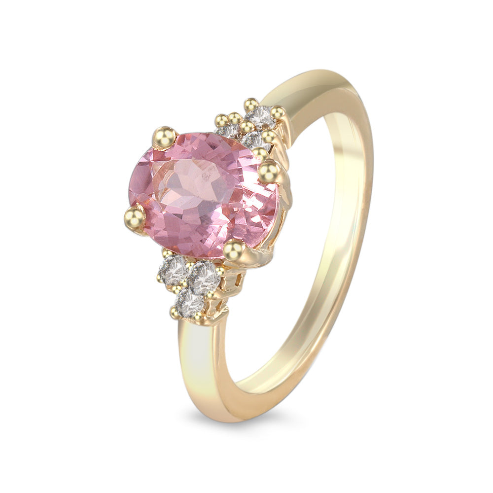 Anillo con turmalina rosa y diamantes laterales