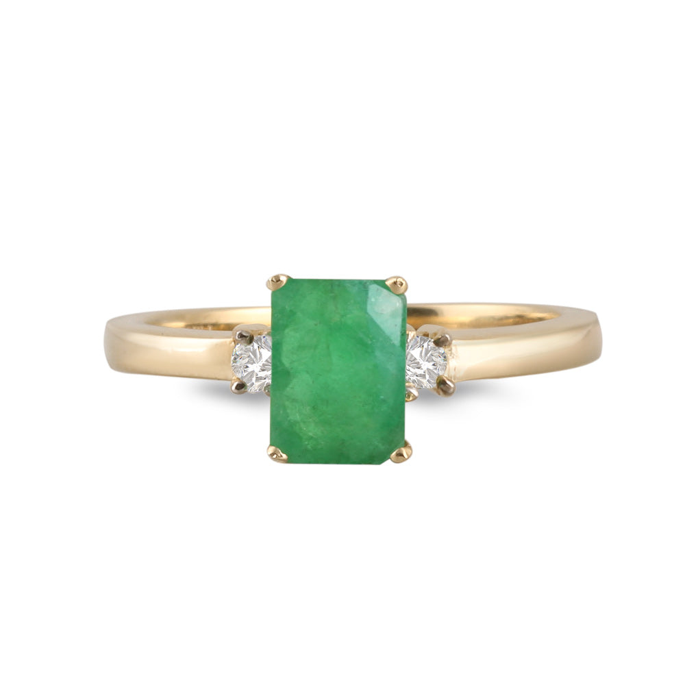 Anillo con esmeralda y diamantes laterales