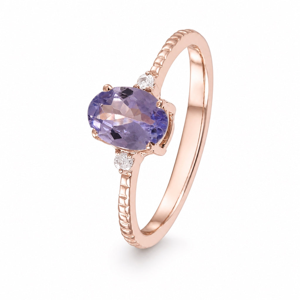 Anillo oro rosa con tanzanita y diamantes laterales