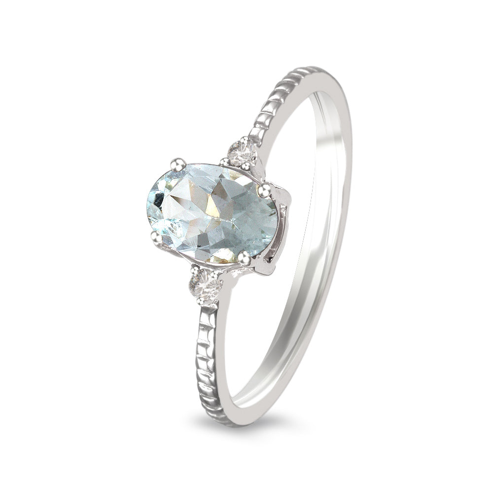 Anillo con aguamarina y diamantes laterales (Marzo)