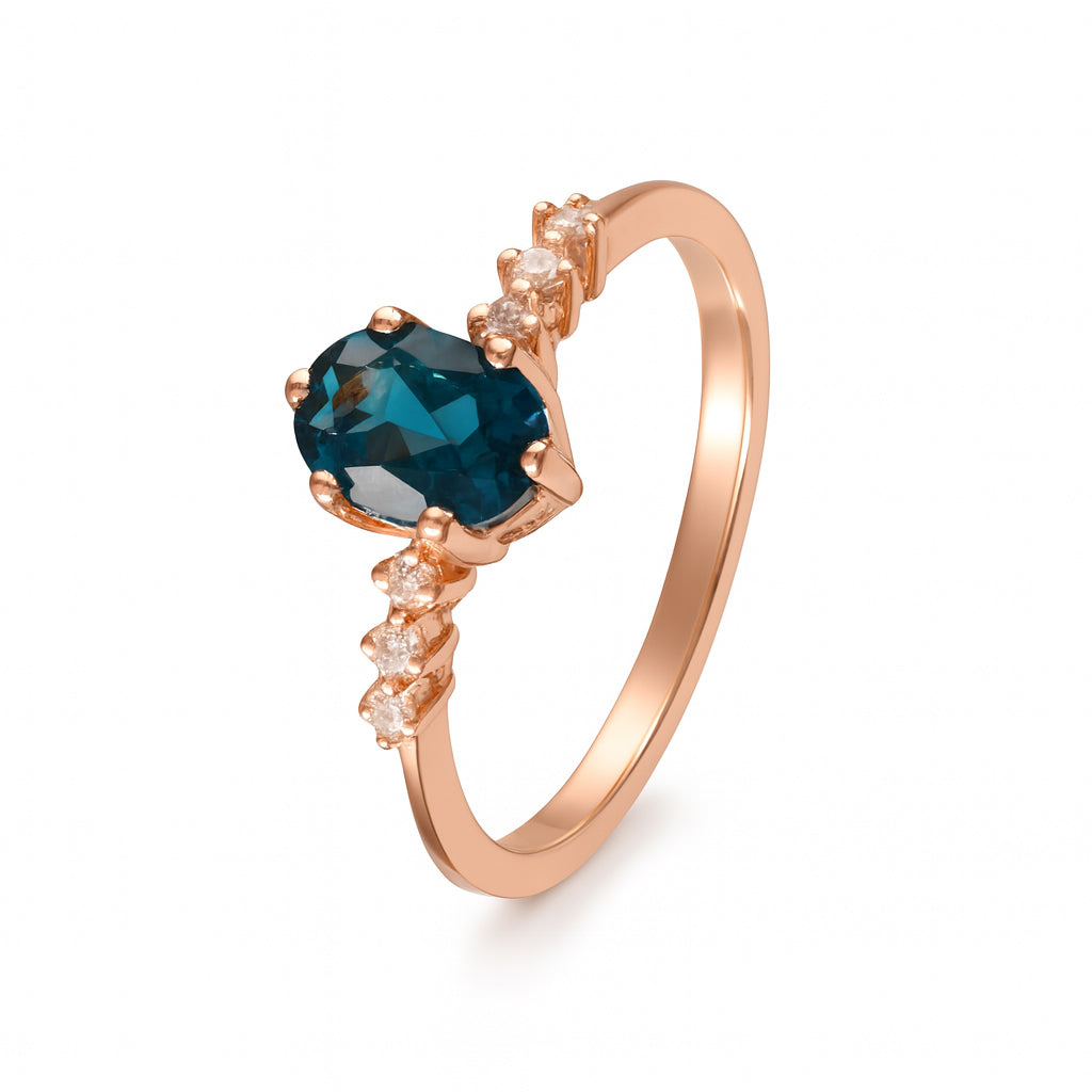 Anillo con topacio london y diamantes laterales