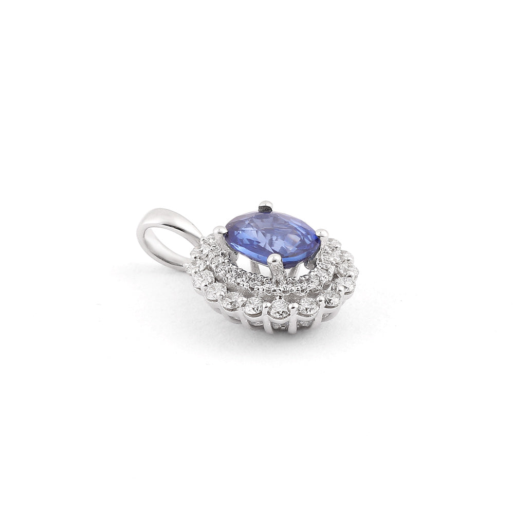 Dije con zafiro oval y diamantes laterales en oro blanco