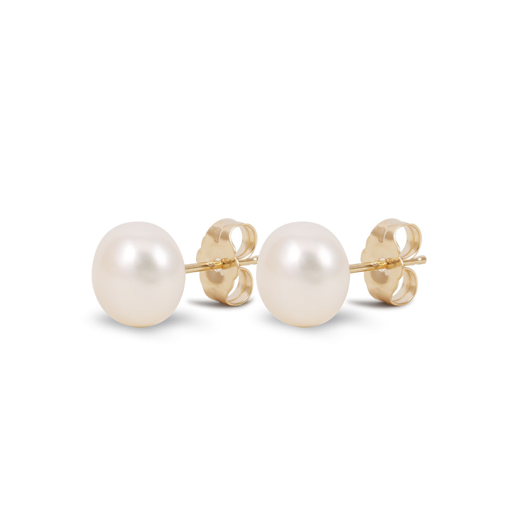 Aretes con perla de agua dulce en oro amarillo de 14K
