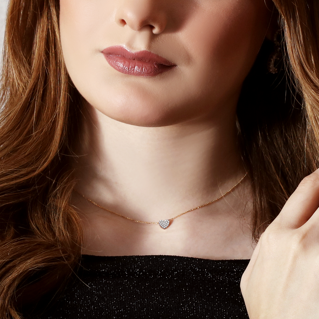 Cadena con dije corazón con diamante 0.11 ct