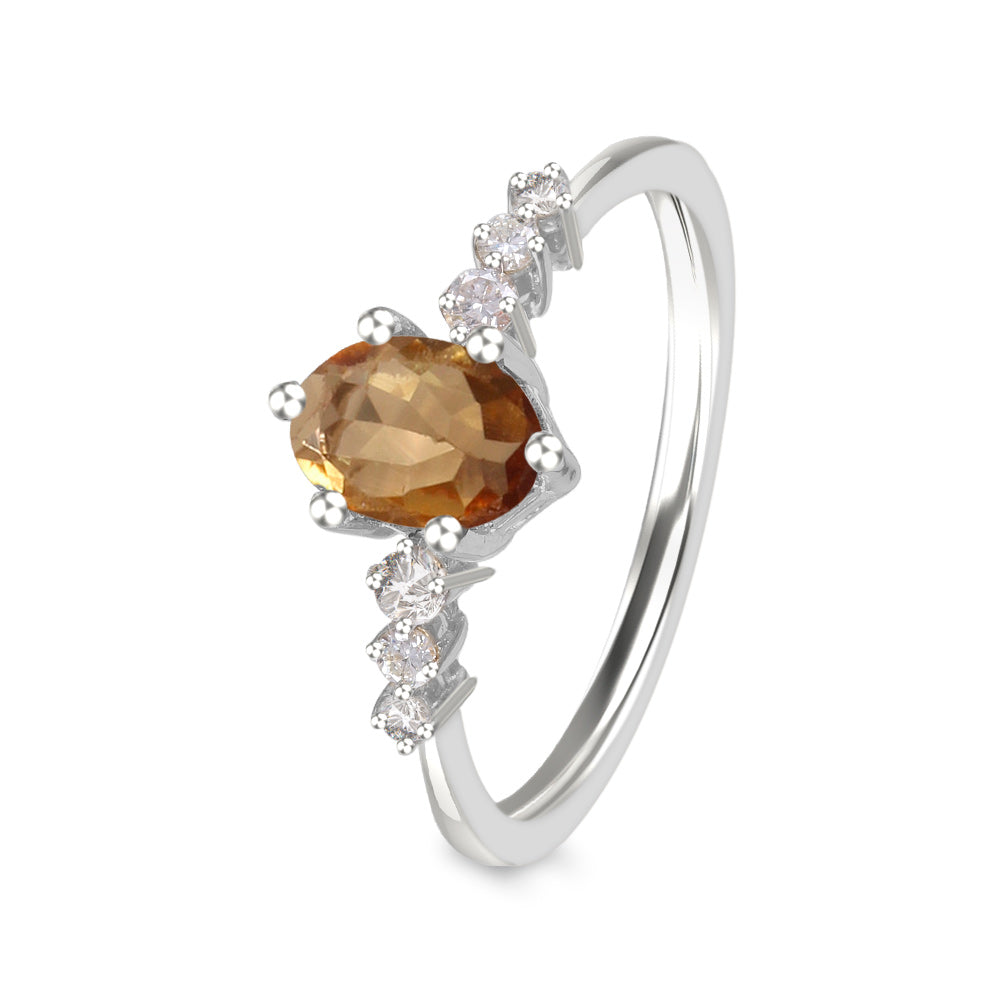 Anillo con turmalina amarilla y diamantes laterales