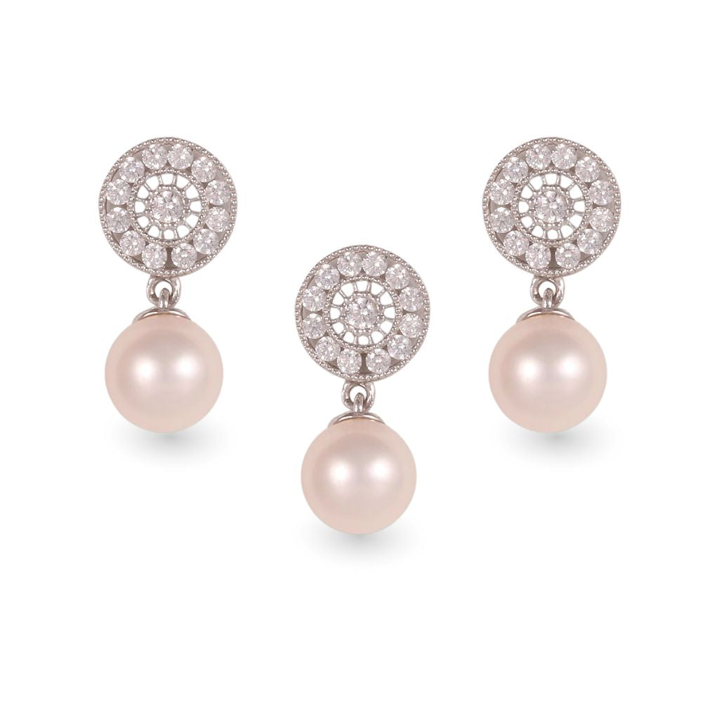 Juego de dije y aretes con perla en oro blanco de 14k