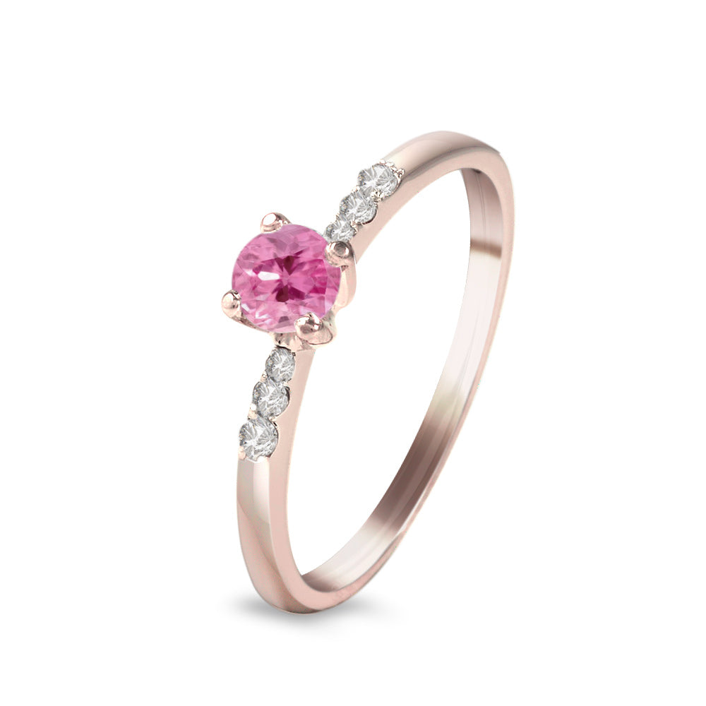 Anillo con zafiro rosa y diamantes laterales
