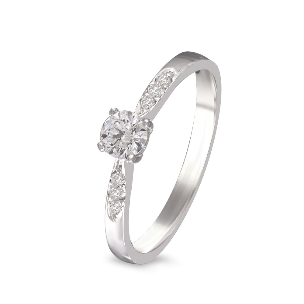 Anillo de compromiso con diamante central 0.30 ct y diamantes laterales