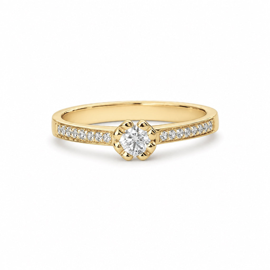 Anillo de compromiso con diamante central 0.20 ct y diamantes laterales
