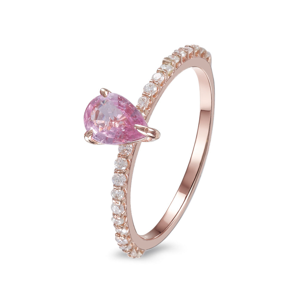 Anillo con zafiro rosa y diamantes laterales