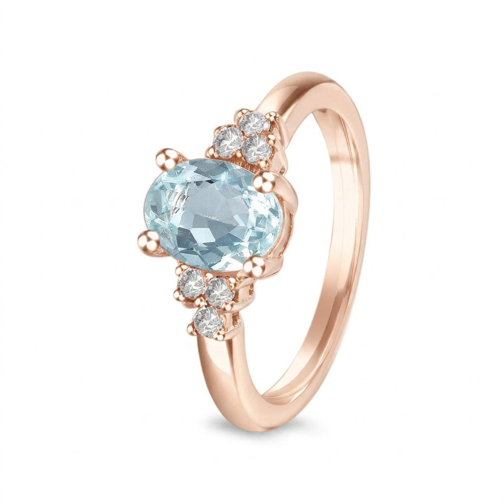 Anillo de oro rosa con aguamarina y diamantes