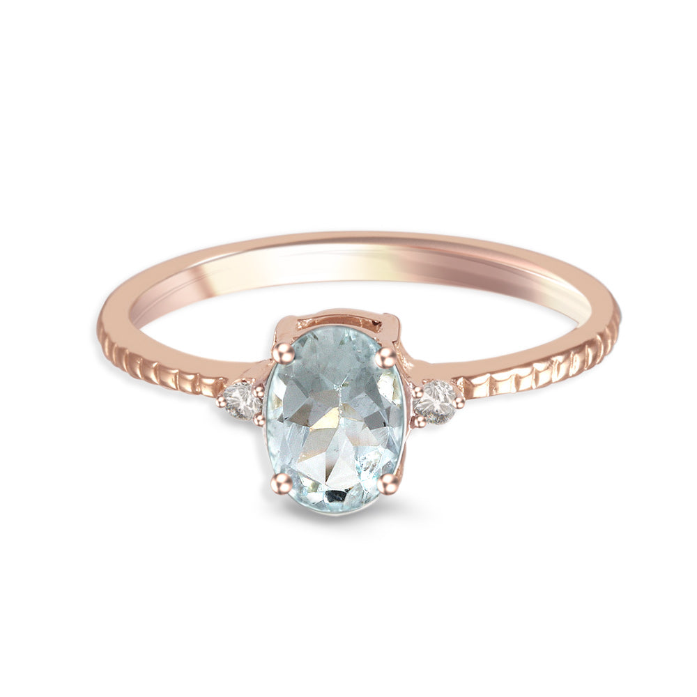Anillo con aguamarina y diamantes laterales (Marzo)