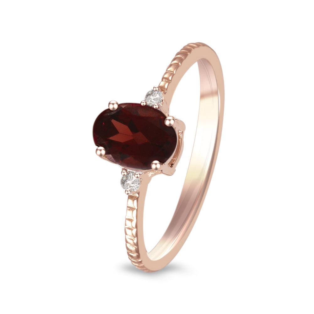 Anillo con granate  y diamantes laterales (Enero)
