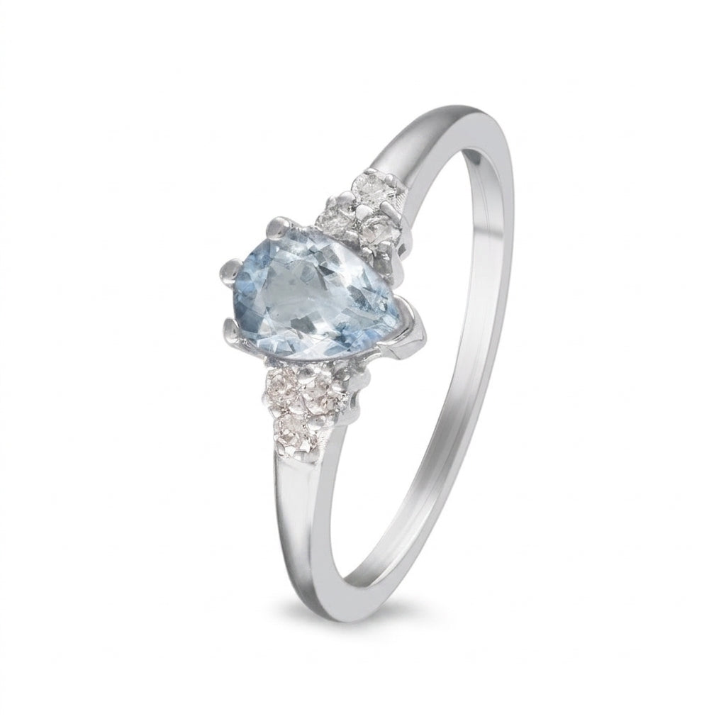 Anillo de oro blanco con aguamarina y diamantes laterales