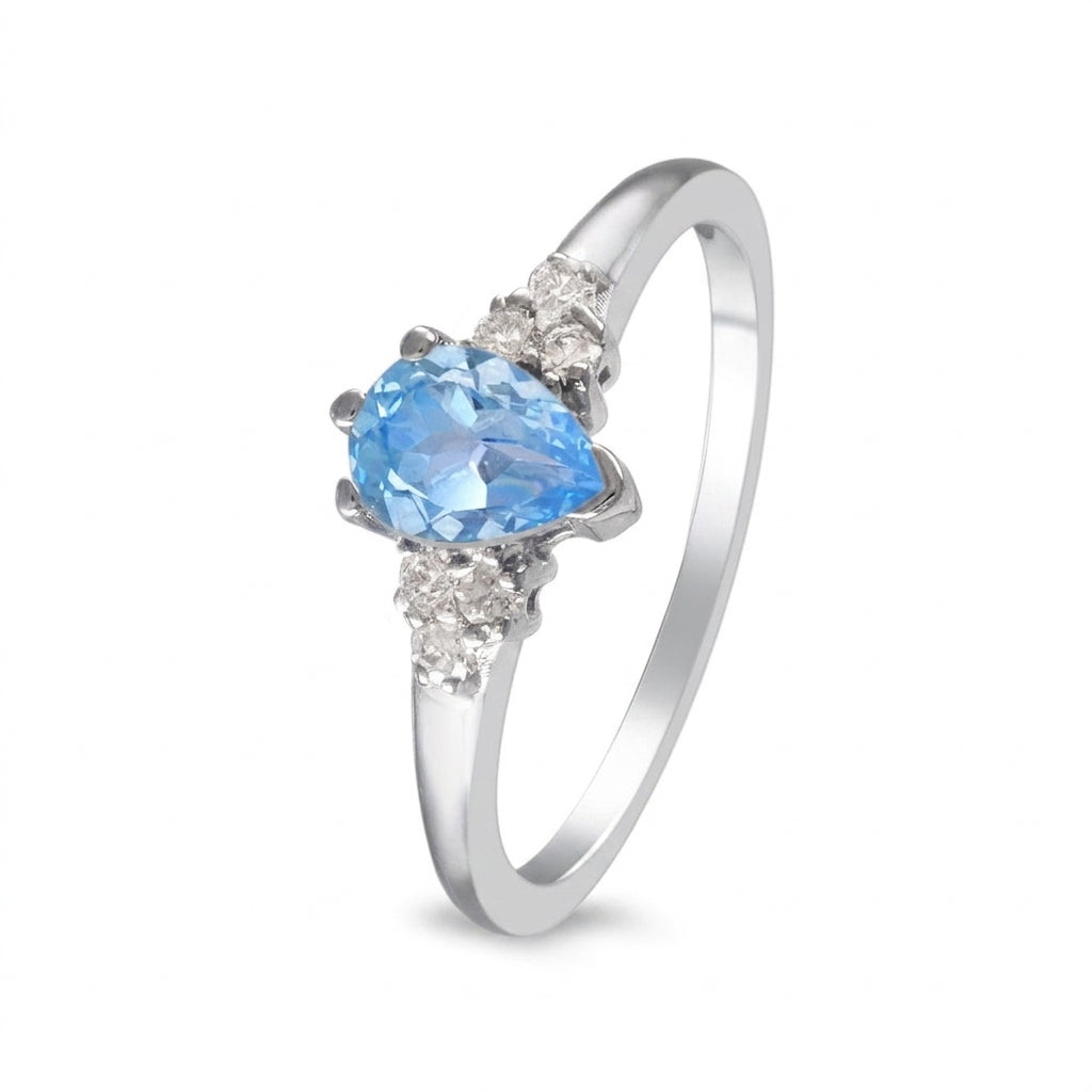 Anillo de oro blanco con topacio y diamantes laterales
