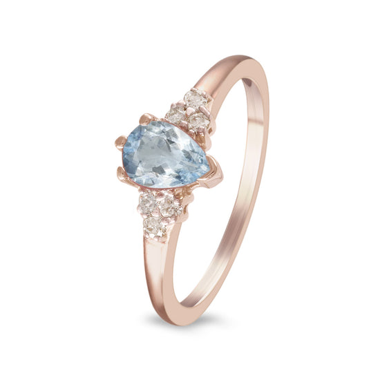 Anillo con aguamarina y diamantes laterales en oro rosa