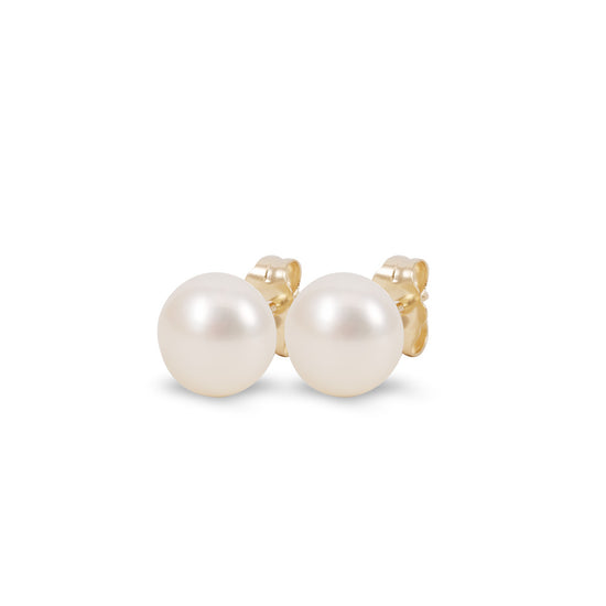 Aretes con perla de agua dulce en oro amarillo de 14K