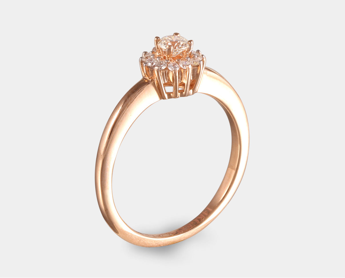 Anillo de Compromiso con halo de diamantes en oro rosa de 14 k. 